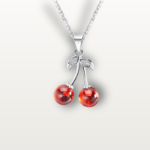 Close-up of the Cherry-Inspired Sterling Silver Necklace with a sparkling crystal cherry pendant.